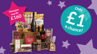 Luxury food and drink hamper worth £160 with wine, snacks, and treats, available to win the Lottery Christmas Superdraw entry for only £1 a chance.