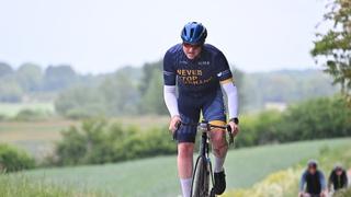 Cyclist taking part in a RIDE wearing an Action jersey