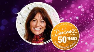 Davina McCall smiles on a sparkly purple bokeh background next to a "Celebrating Davina's 50 Years" gold emblem.