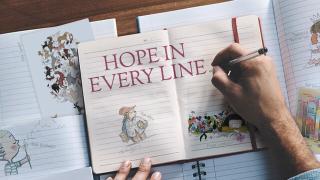 Open notebooks display illustrations and the text "HOPE IN EVERY LINE," with a hand writing in one with a pen.