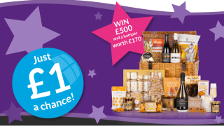 A gift hamper with text reading "WIN £500 and a hamper worth £170" and "Just £1 a chance!" on a purple starry background.
